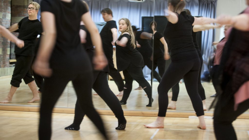 People dancing in black clothes
